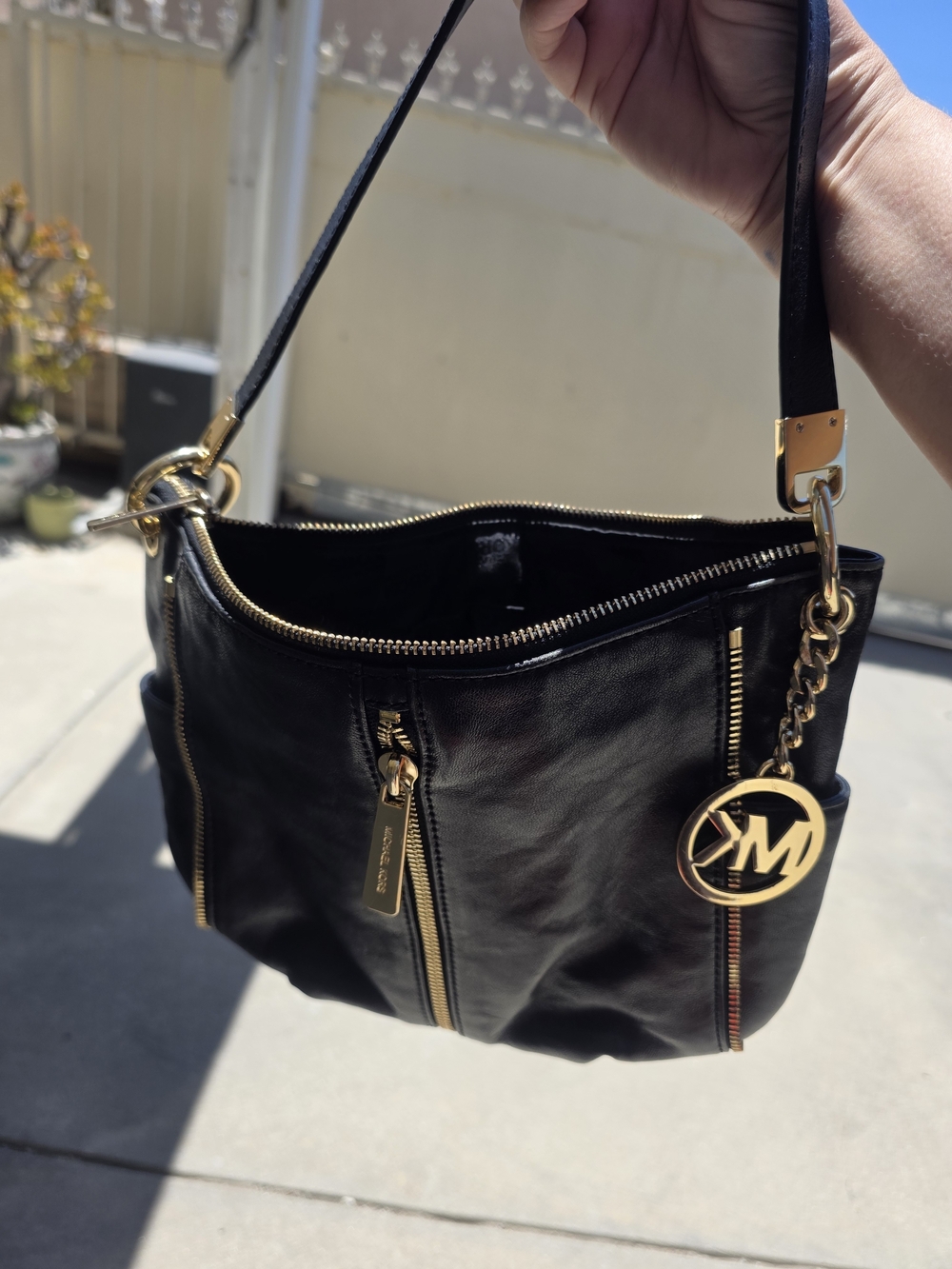 Michael Kors Black Leather Shoulder Bag with Gold Accents and MK Charm